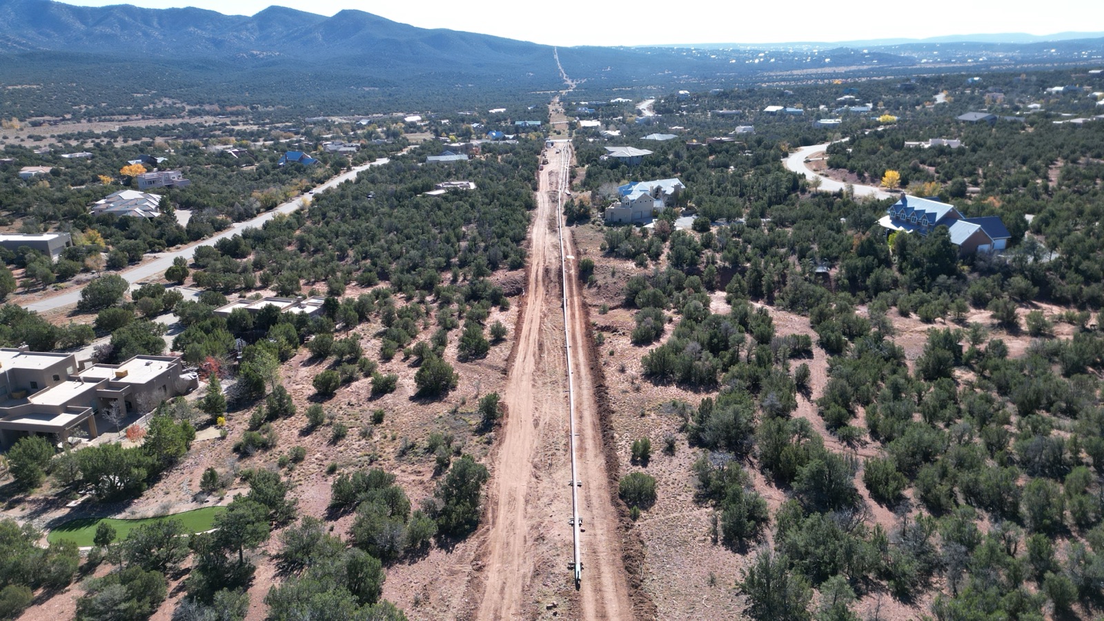 Aerial view of a horizontal directional drill alignment beneath a golf course